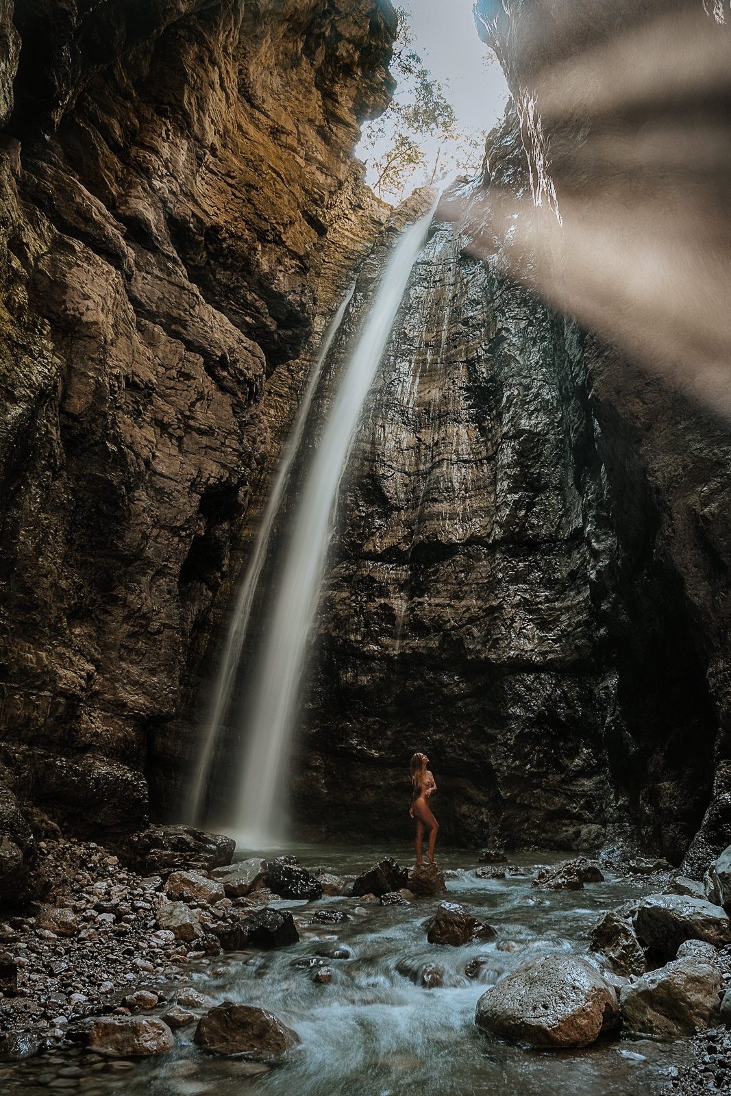 Erica Vignola photographed by Nico Ruffato in a beautiful waterfall in the Dolomites.